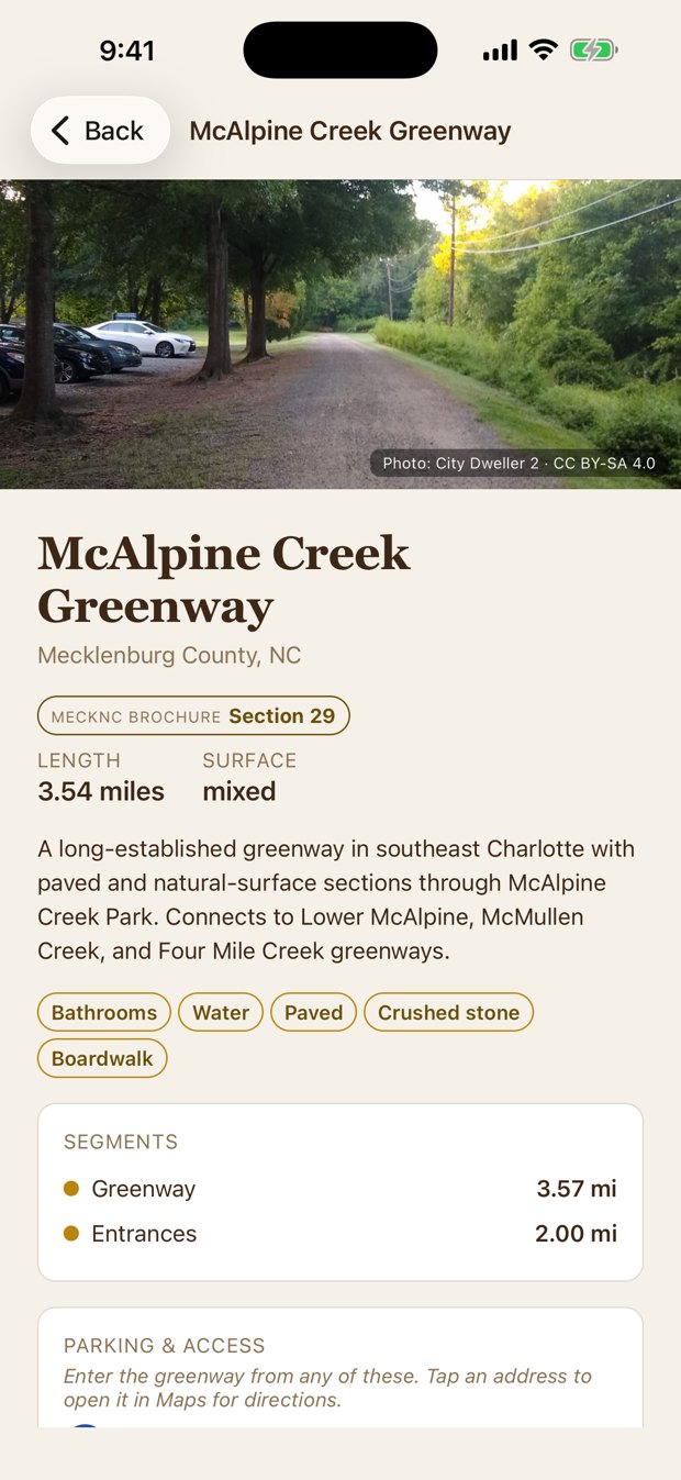 A greenway page with photo, parking addresses, length, and amenities